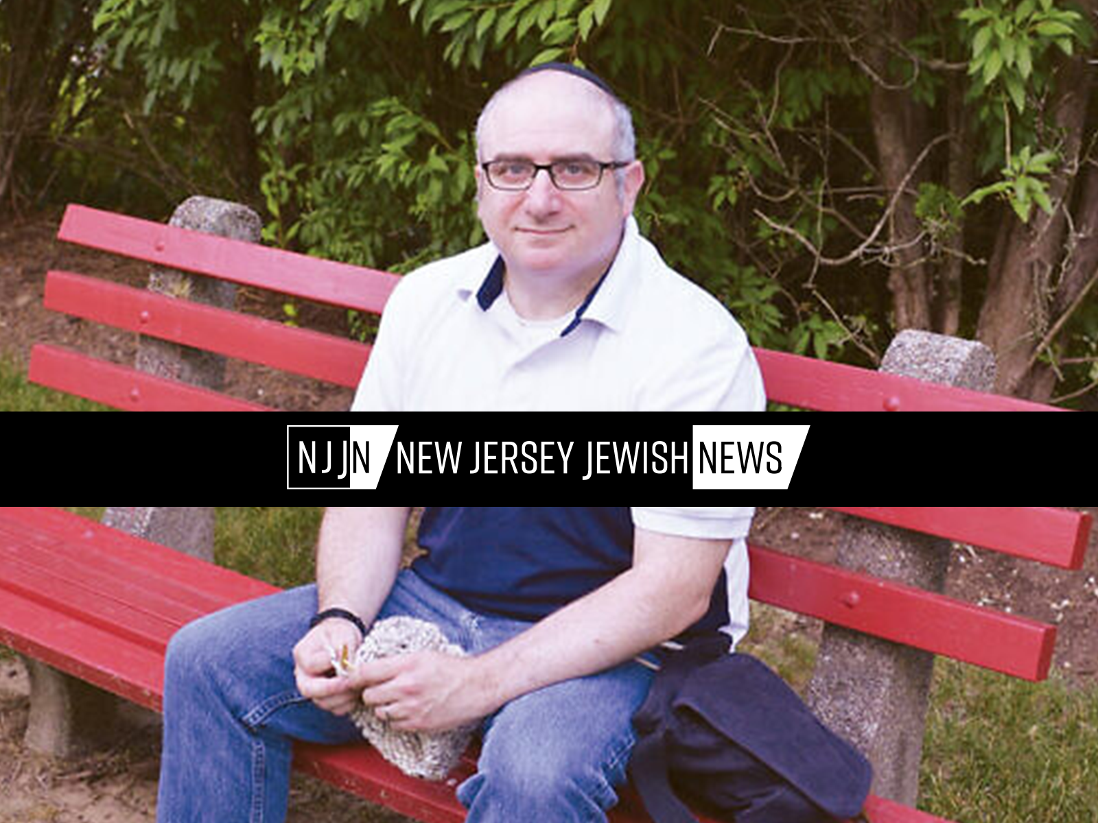 New Jersey Jewish News logo overlaid on photo of Eric Schorr