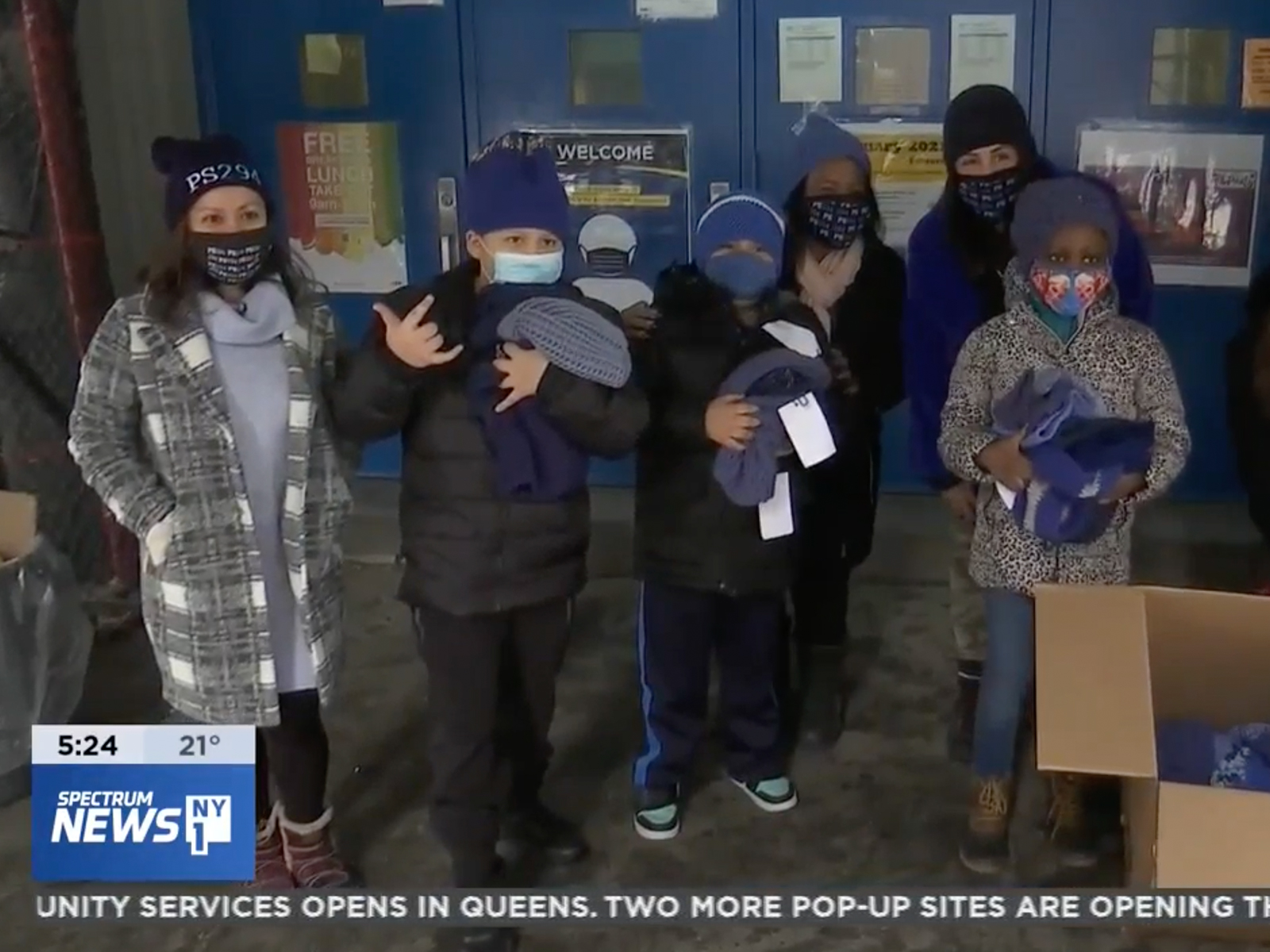 Spectrum News NY1 still frame of students in blue hats